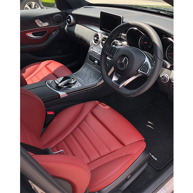 The car's gorgeous interior, complete with red leather seats