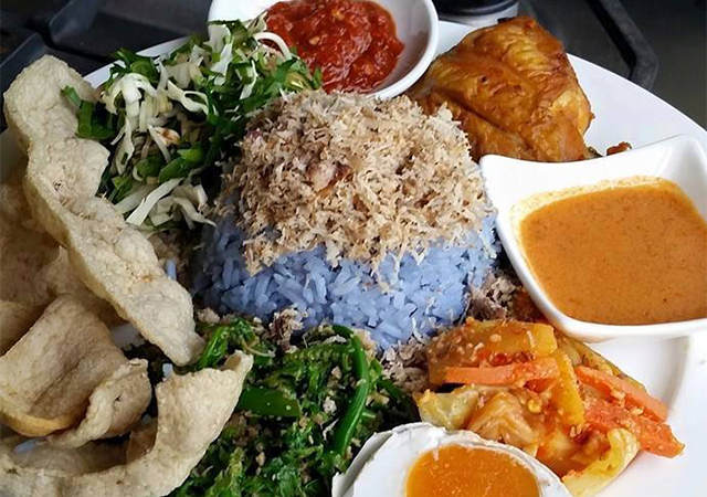 Nasi Kerabu with side dishes and grilled spiced chicken by Garden to Table
