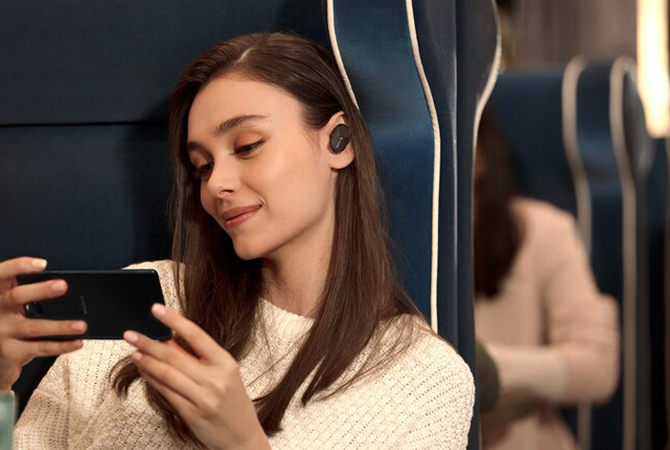 Sony WF-1000MX3 headphones woman in train with black
