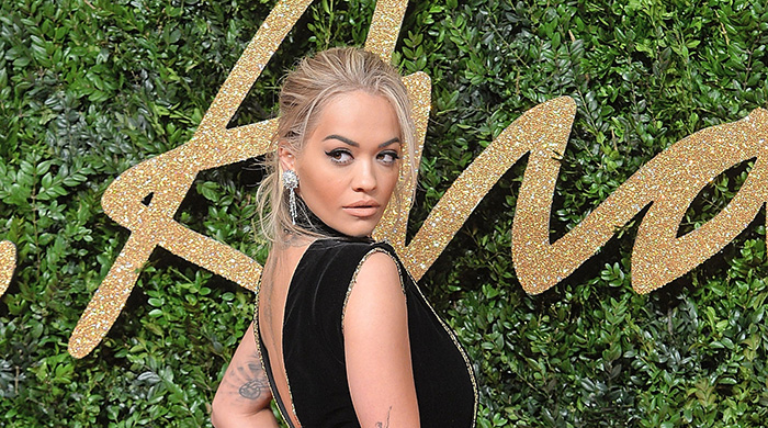 Rocking blonde hair and dark brows the Rita Ora way